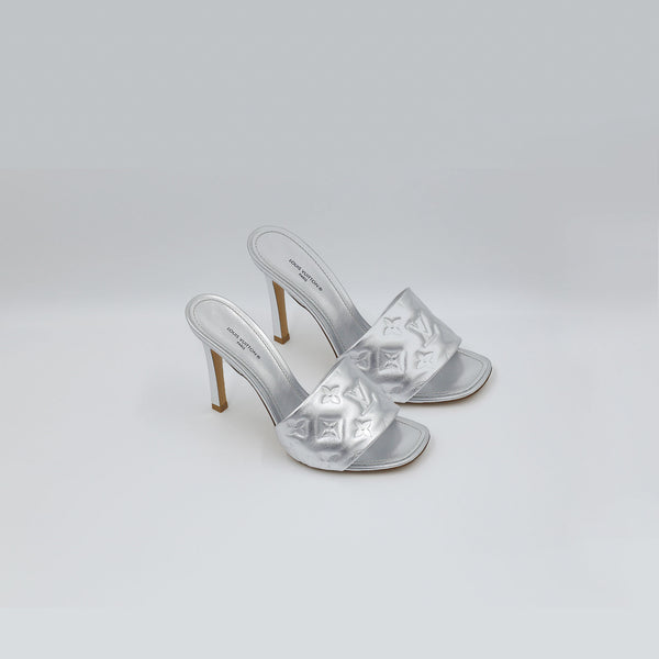 LOUIS VUITTON Monogram Embossed Leather Revival Mule Sandals|Silver